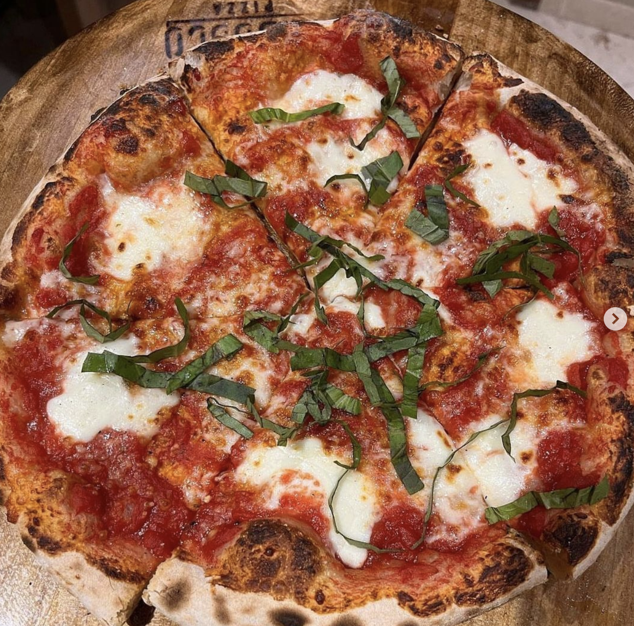 Margherita pizza with fresh mozzarella and basil